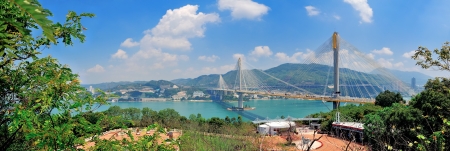 Ting Kau Bridge in Hong Kong over sea in the day with blue skyのeditorial素材
