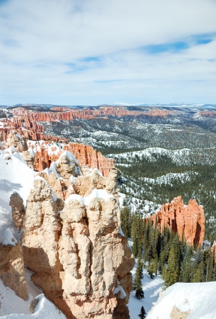 Bryce canyon panorama with snow in Winter with red rocks and blue sky. の写真素材