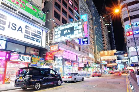 HONG KONG, CHINA - APR 23: Crowded street view at night on April 23, 2012 in Hong Kong, China. With 7M population and land mass of 1104 sq km, it is one of the most dense areas in the world.のeditorial素材