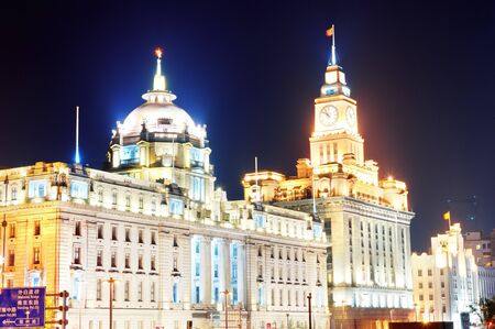 Shanghai historic architecture at night on street with lights.