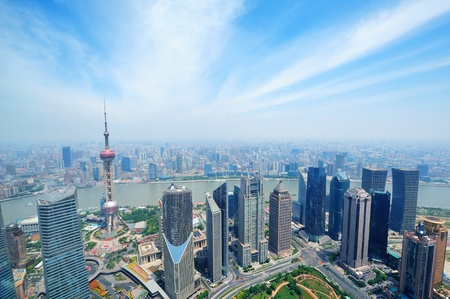 Shanghai city aerial view in the day with blue sky and cloud with Oriental Pearl Tower