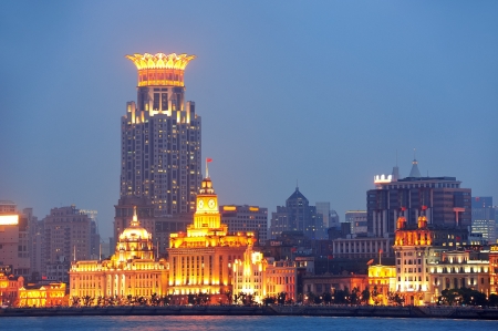 Shanghai urban architecture over river at dusk