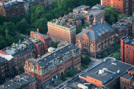 Boston city downtown aerial view with urban historical buildings at sunset.の写真素材