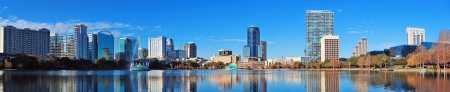 Orlando Lake Eola in the morning with urban skyscrapers and clear blue sky の写真素材