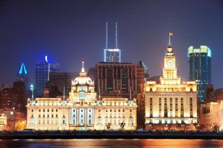 Shanghai historic architecture at night lit by lights over Huangpu Riverのeditorial素材