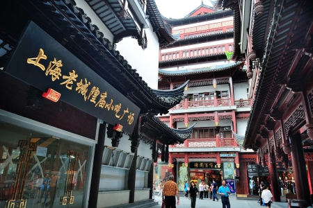 SHANGHAI, CHINA - MAY 30: Chenghuangmiao street with travelers and pagoda style buildings on May 30, 2012 in Shanghai. It is the largest city by population in the world with 23 million in 2010のeditorial素材