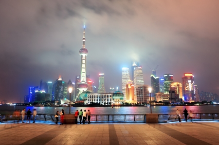 Shanghai urban city skyline over walkway at nightの写真素材