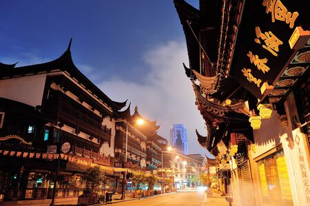 SHANGHAI, CHINA - MAY 30: Chenghuangmiao street at night with pagoda style buildings on May 30, 2012 in Shanghai. It is the largest city by population in the world with 23 million in 2010のeditorial素材