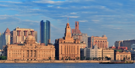 Shanghai historic and urban buildings panorama over Huangpu River in the morning with blue sky の写真素材