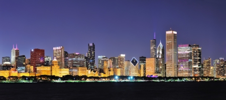 Chicago city downtown urban skyline panorama at dusk with skyscrapers over Lake Michigan with clear blue sky の写真素材