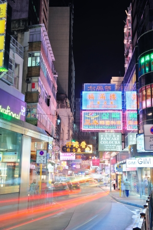 HONG KONG, CHINA - APR 23: Crowded street view at night on April 23, 2012 in Hong Kong, China. With 7M population and land mass of 1104 sq km, it is one of the most dense areas in the world.のeditorial素材