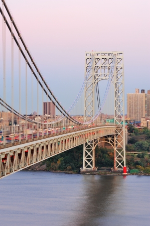 George Washington Bridge at sunset over Hudson River.の写真素材