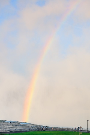 Rainbow in mist from Horseshoe Falls in Niagara Falls in the morning after sunriseの写真素材