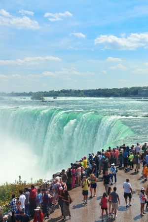 NIAGARA FALLS, NY - SEPT 1: Visitors watch Horseshoe Falls on September 1, 2012 in Niagara Falls, New York. Niagara Falls is the waterfalls with the highest flow rate in the world. のeditorial素材