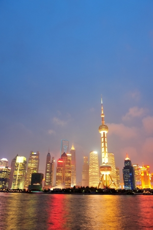 Shanghai city skyline at night over Huangpu riverのeditorial素材