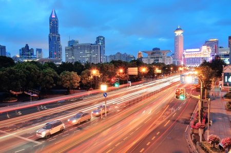 Shanghai street view with urban scene and busy traffic at dusk.のeditorial素材