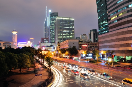 Shanghai street view with urban scene and busy traffic at dusk.の写真素材