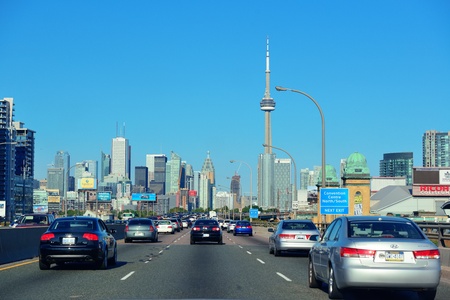 TORONTO, CANADA - JULY 3: Toronto highway with cityscape on July 3, 2012 in Toronto, Canada. Toronto with the population of 6M is the provincial capital of Ontario and the largest city in Canada.のeditorial素材