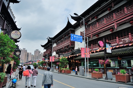 SHANGHAI, CHINA - MAY 30: Chenghuangmiao street with travelers and pagoda style buildings on May 30, 2012 in Shanghai. It is the largest city by population in the world with 23 million in 2010のeditorial素材