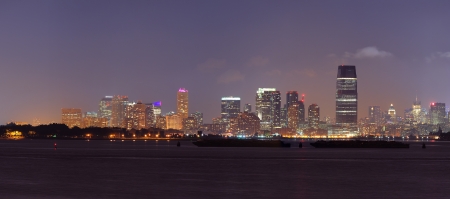 New Jersey skyline at night with urban city skyline over river panorama view の写真素材