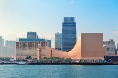 Urban architecture in Hong Kong Victoria Harbor in the day with blue sky and cloud.のeditorial素材