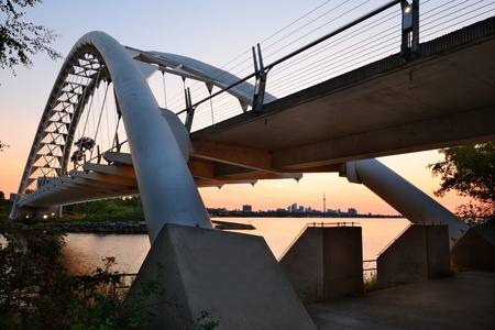 TORONTO, CANADA - JULY 3: Bridge with Toronto skyline at sunrise on July 3, 2012 in Toronto, Canada. Toronto with the population of 6M is the capital of Ontario and the largest city in Canada.のeditorial素材