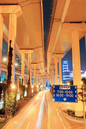 Highway bridge in Shanghai with busy traffic at night.の写真素材