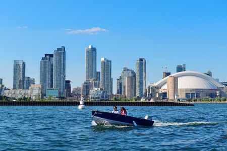 TORONTO, CANADA - JULY 3: Toronto skyline with boat on July 3, 2012 in Toronto, Canada. Toronto with...