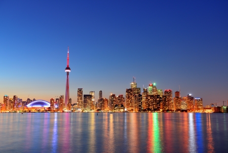 Toronto sunset over lake panorama with urban skyline.の写真素材