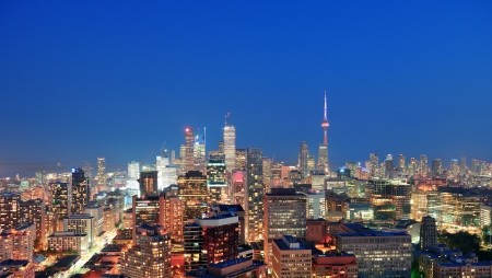 Toronto at dusk with city light and urban skyline with skyscrapersの写真素材
