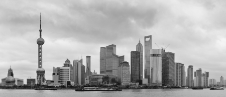 Shanghai skyline over river in overcast day in black and whiteの写真素材