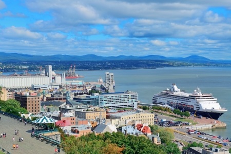 Cruise ship and lower town old buildings with blue sky in Quebec City.の写真素材