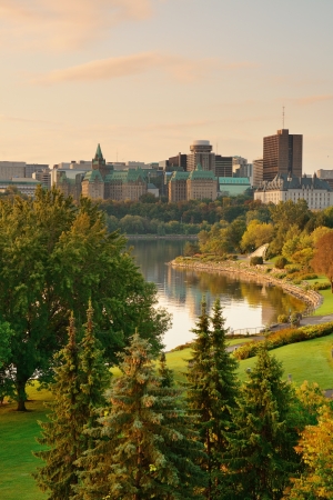 Ottawa city skyline at sunrise in the morning over river with urban historical buildings and colorful cloudの写真素材