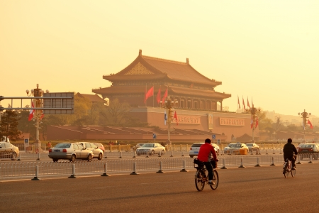 BEIJING, CHINA - APR 6: Tiananmen sunrise with street on April 6, 2013 in Beijing, China. Tiananmen is a famous monument in Beijing and serves as a national symbol.のeditorial素材