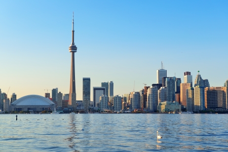 Toronto skyline in the day over lake with urban architecture and blue skyの写真素材