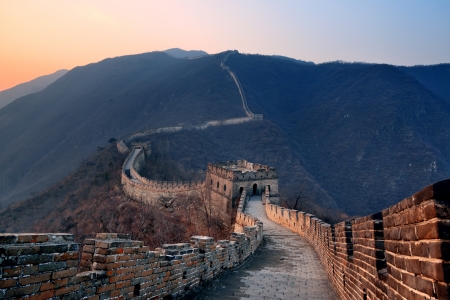 Great Wall sunset over mountains in Beijing, China.の写真素材
