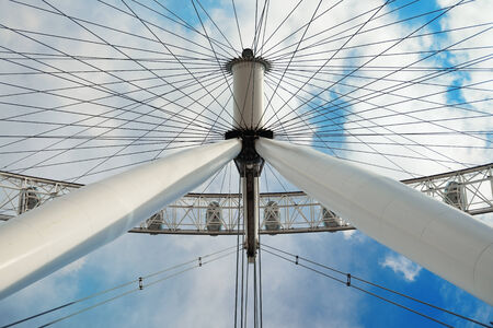 LONDON, UK - SEP 26: London Eye over Thames River on September 26, 2013 in London, UK. It is Europe's tallest Ferris wheel and the most popular paid tourist attraction in UKのeditorial素材