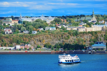 Ferry boat in river in Quebec City with blue sky の写真素材