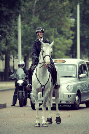 LONDON, UK - SEP 27: Policeman on horseback in street on September 27, 2013 in London, UK. London is...