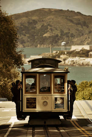 San Francisco, CA - MAY 11: Cable car in street on May 11, 2014 in San Francisco. It is the world's last manually-operated cable car systemのeditorial素材