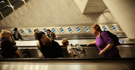 LONDON, UK - SEP 27: Subway escalator with tourists on September 27, 2013 in London, UK. London is the world's most visited city and the capital of UK.のeditorial素材