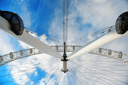 LONDON, UK - SEP 26: London Eye over Thames River on September 26, 2013 in London, UK. It is Europe's tallest Ferris wheel and the most popular paid tourist attraction in UKのeditorial素材