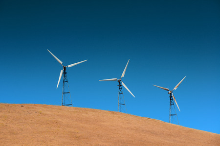 Wind turbine over mountain near San Francisco.の写真素材