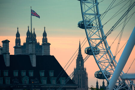 LONDON, UK - SEP 26: London Eye over Thames River on September 26, 2013 in London, UK. It is Europe's tallest Ferris wheel and the most popular paid tourist attraction in UKのeditorial素材
