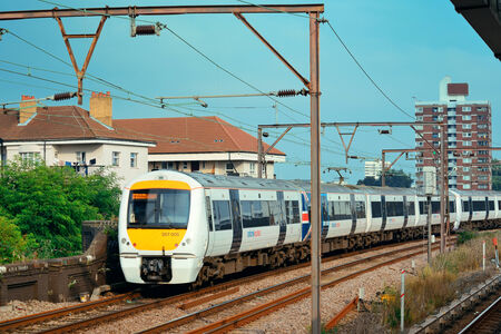 LONDON, UK - SEP 27: Train arrive at platform in London on September 27, 2013 in London, UK. London is the world's most visited city and the capital of UK.のeditorial素材