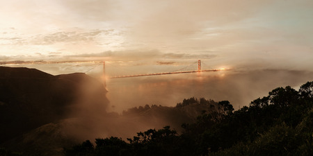 Golden Gate Bridge and fog in San Francisco viewed from mountain top