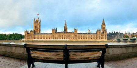 Westminster panorama with chair at waterfront in London  の写真素材