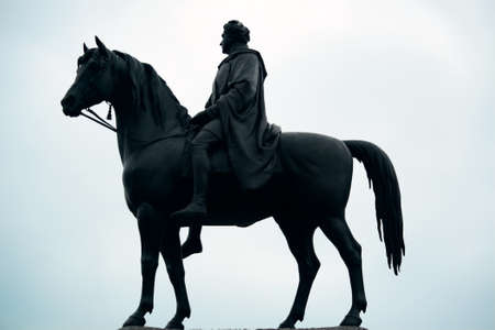 Statue silhouette in street in London.の写真素材