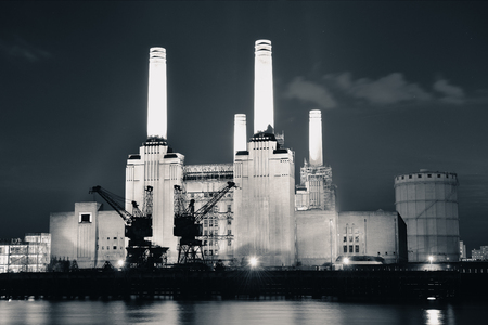 Battersea Power Station over Thames river as the famous London landmark at night.のeditorial素材