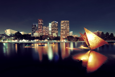 Los Angeles downtown at night with urban buildings and lakeの写真素材